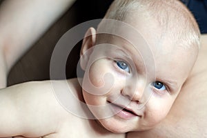 A child listens to his mother`s pregnant belly, portrait