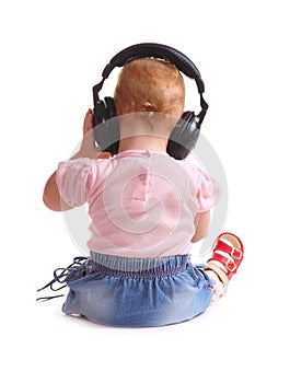 The child listens to music