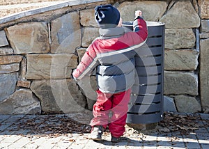 Child and litter or waste bin