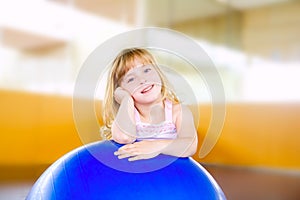Child little girl with gym aerobics ball