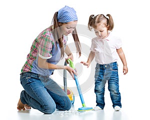 Child little girl and mom cleaning room
