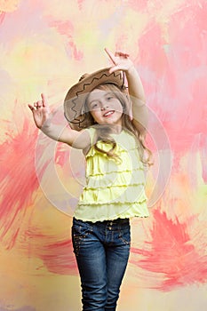 Child or little happy smiling girl in cowboy hat