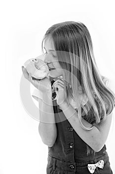 Child look at donut isolated on white. Little girl with glazed ring doughnut. Kid with junk food. Unhealthy eating and