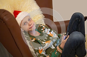 Child looking at camera at Christmas party at home happily on holiday