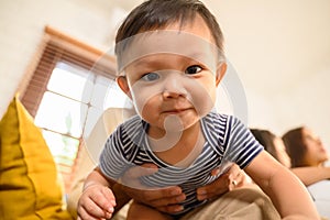 child looking camera. Portrait of child 1 year old, family photo.