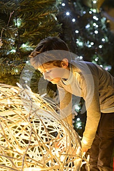 Child looking at Christmas lights