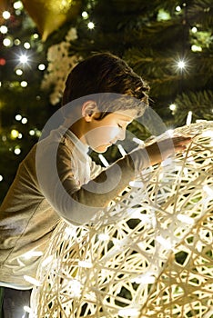 Child looking at Christmas lights