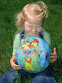 Child looking at globe