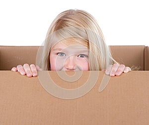 Child looking out of a box