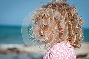 Child looking out towards the sea