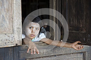 Child looking out the window of school