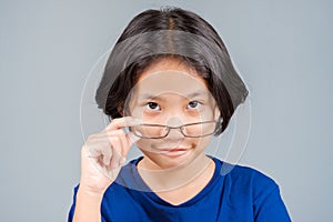 Child Looking Over Eyeglasses