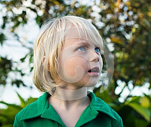 Child looking with wonder in nature