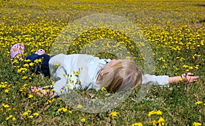 Child lying in flower field