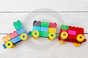 Child made of constructor train. Developing toys