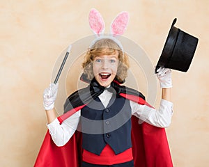 Child magician wearing rabbit ears