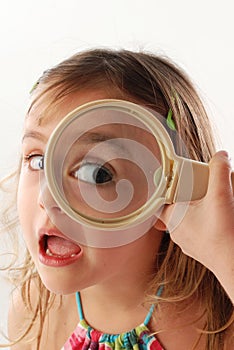 Child with magnifying glass