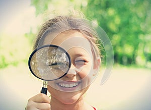 child and magnifying glass