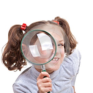 Child with magnifying spy glass