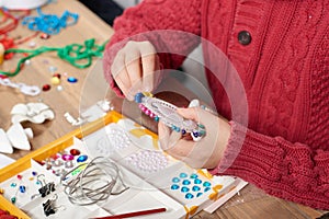 Child make crafts and toys, handmade concept. Artwork workplace with creative accessories.