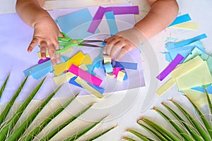 Child Make Paper Colorful Garland For Sukkah -Jewish Holiday, or for Christmas.