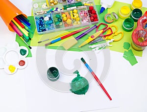 The child makes a craft toy from foam plastic tortoise. Material for creativity and education