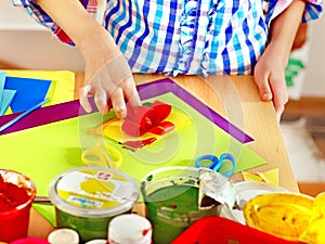 Child making decoration card..