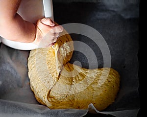 Child making dough