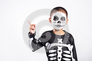 Child man horror face painting make up for ghost scary point finger to side space