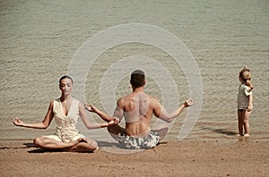 Child, man and woman meditating, yoga pose, famile