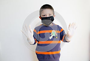 A child with mask and protective gloves. Photo about covid protection.