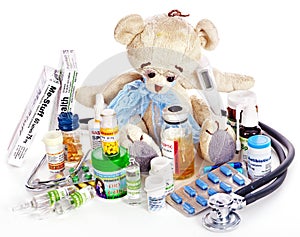 Child medicine and teddy bear.