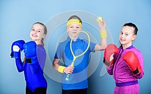 Child might excel completely different sport. Sporty siblings. Girls kids with boxing sport equipment and boy tennis
