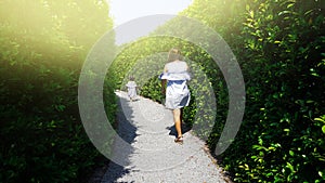 Child and mom escape maze green plant wall