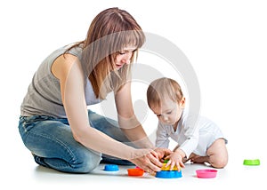 Child and mom play with block toys