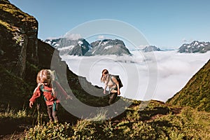 Child and mother family hiking in mountains of Norway, active healthy lifestyle adventure tour outdoor