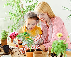 child mother family parent home woman flower gardening plant garden daughter kid together greenhouse