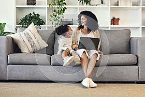 Child, mother and laptop in family home living room for remote work, online education and wifi. Happy woman and girl kid