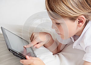 Child with multimedia tablet PC.