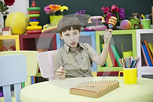 A child with a musical instrument.