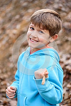 Child and nature. A beautiful boy in the forest.