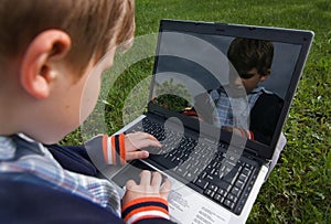 Child with notebook outdoor