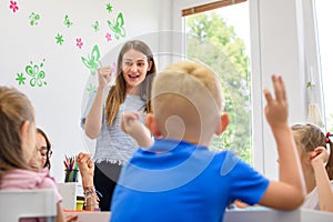 Child occupational therapy session. Group of children doing playful exercises with their therapist.