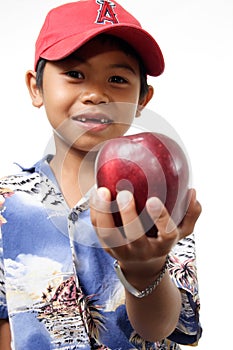 Child offering apple