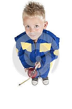 Child with oil pipette in coverall on white