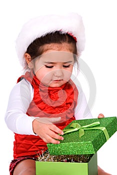 Child opening christmas gift.