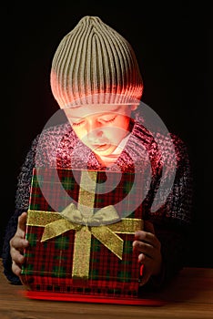 A child opening a gift box.