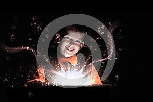 Child opening a magic gift box