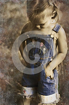 Child in overalls in vintage tones