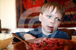 Child overeat salad of beetroot